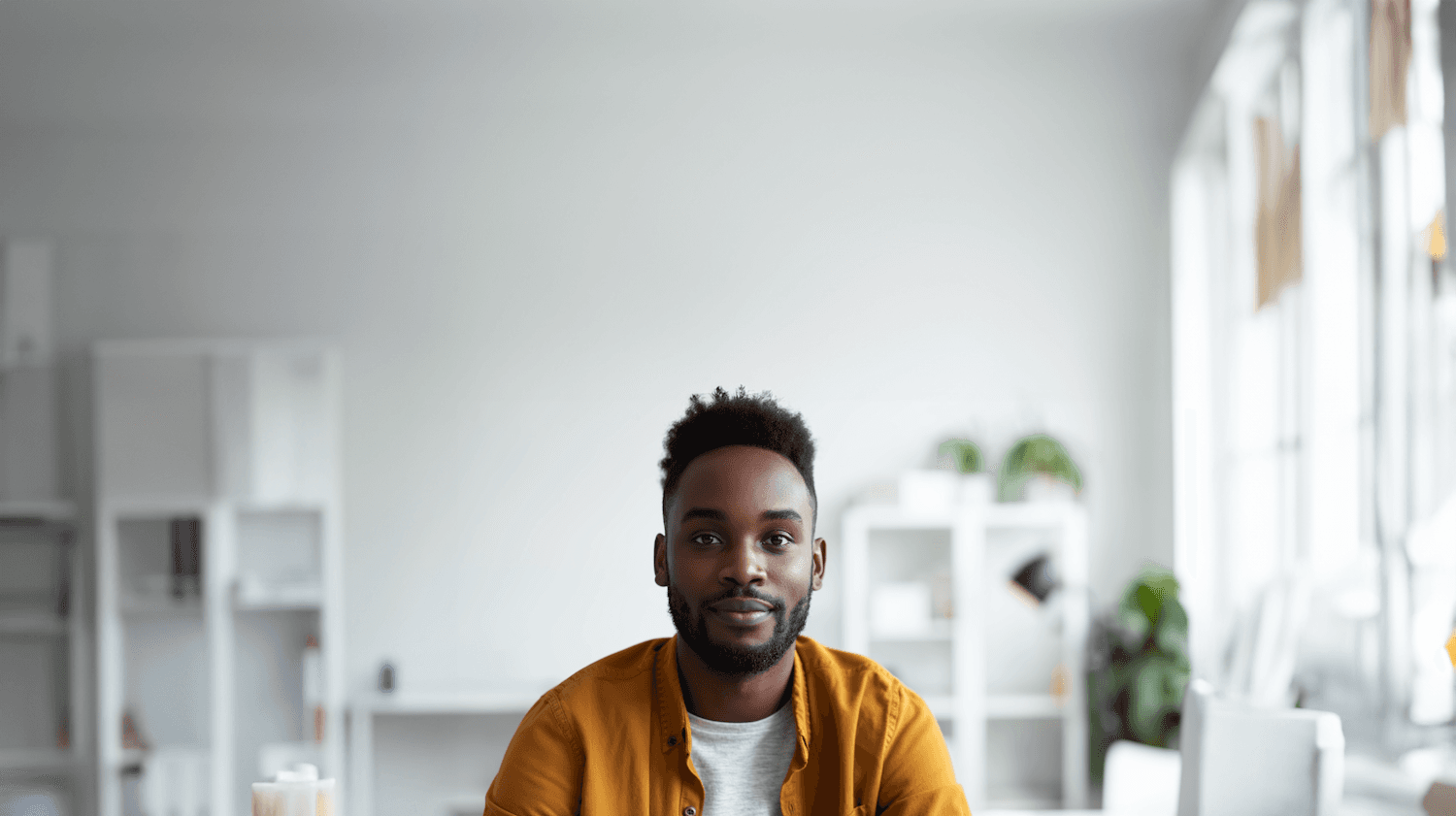 Presenter in a mustard shirt in a bright office
