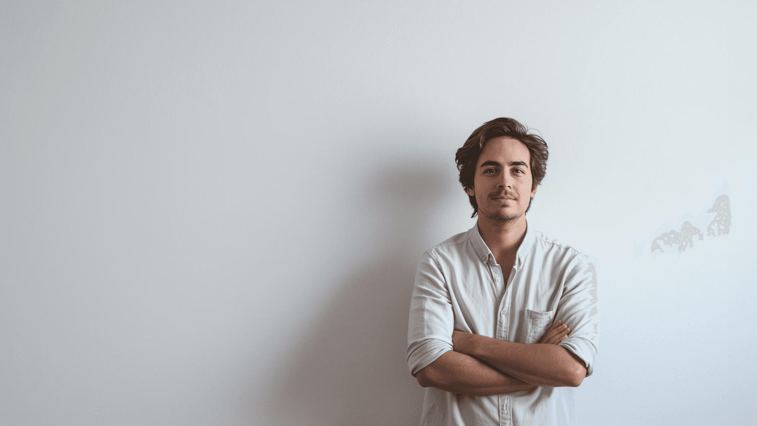 Presenter in a light shirt against a plain backdrop